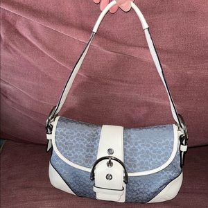 Soho coach hand bag. Small handbags features buckles and flap enclosure. Clean.